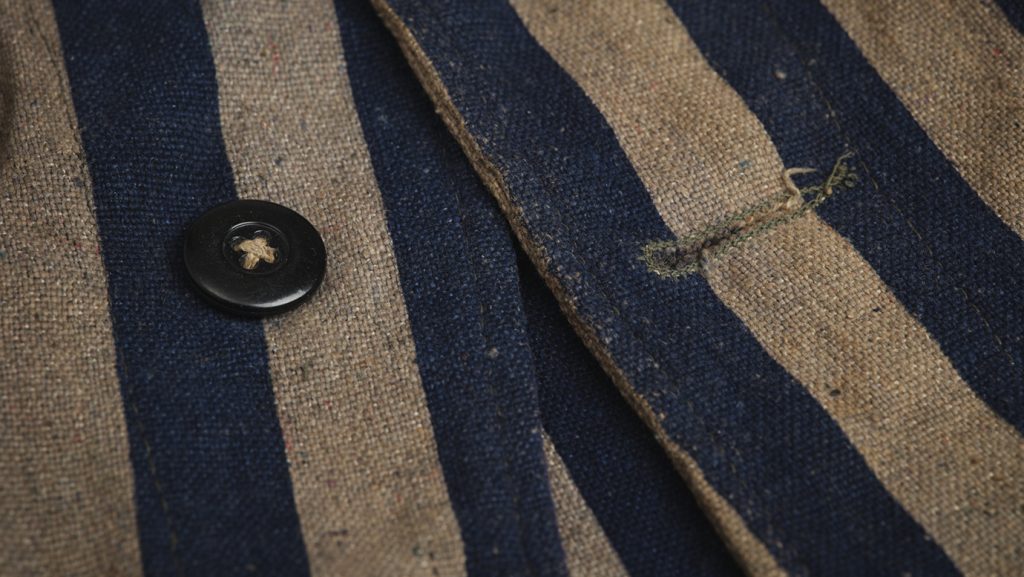 Detail of striped prisoner jacket.