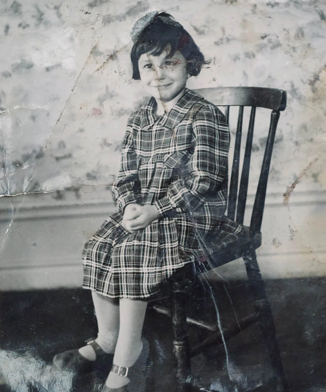 Rose-Marie sitting on a chair.